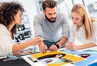 A design team examines various proofs.